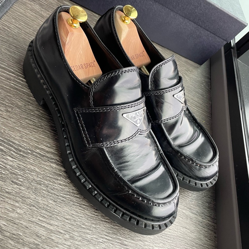 Prada black brushed leather loafers for sale. Lightly worn with slight damage.